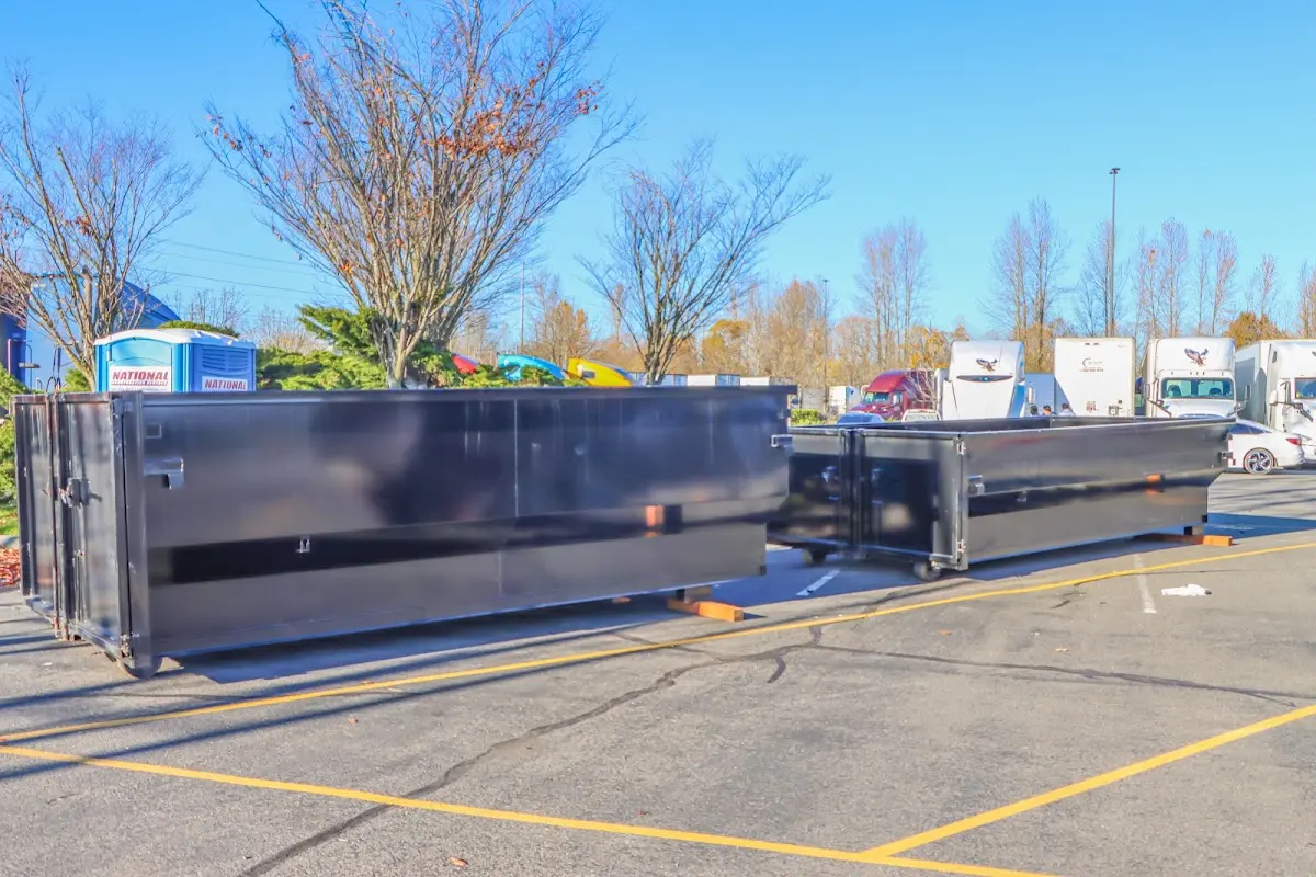 Professional dumpster rental service with roll-off container on residential driveway in Dalhart